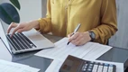 Bookkeeper working to manage a client's financial records.