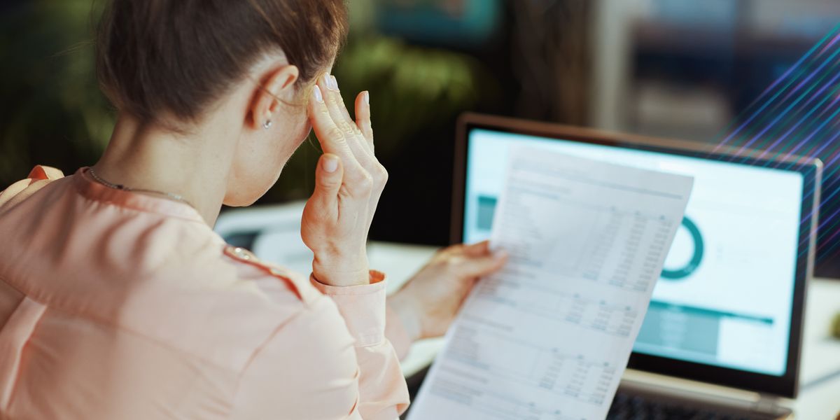 Woman reviewing a sales tax notice letter.