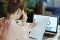 Woman reviewing a sales tax notice letter.